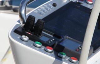 Variable speed control joystick panel in dashboard on a boat